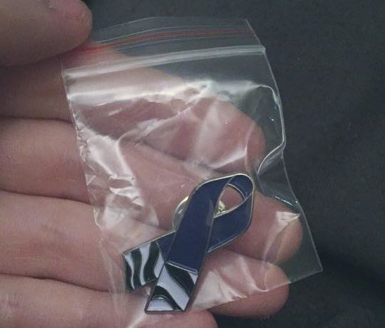 Students make pins in honor of late classmate