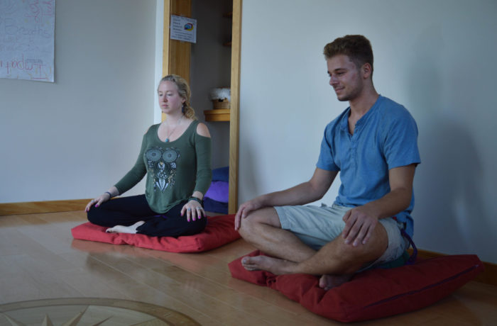 Kendra Smith instructs Jacob Einbinder ’22 in meditation on Tuesday. Smith offers group meditation sessions, welcoming all students, staff, and faculty, in Dion Student Center Tuesdays from 4:15 – 5:15 p.m. and Thursdays from 12-1 p.m. (Photo by Brandon Bielinski)