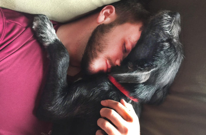 Josh Abernathy ’19 cuddles with his dog, JP, named after his best friend, Jeffrey Paul.
