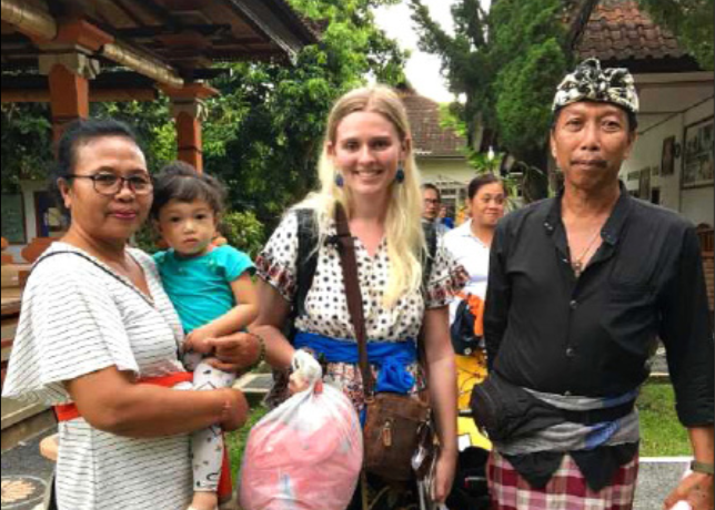 Sarah Carlson-McNally 20’ and the family that is housing her while abroad bring home exotic fruits and ingredients for dinner in Bali, Indonesia.