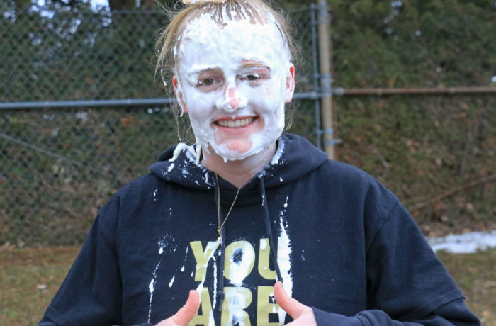 Jordan Monbouquette ’20 gives two thumbs up after being pied to help raise money for Hope Happens Here.